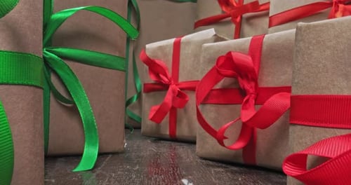 Festive Gifts Wrapped with Green and Red Ribbons