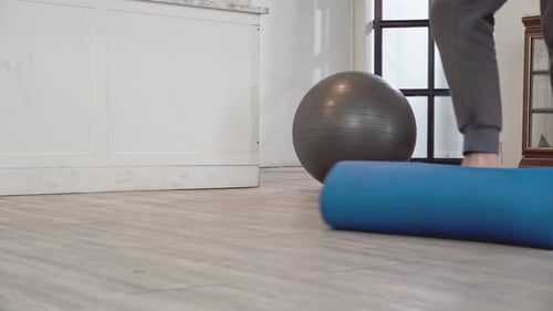 Close up of male foot roll out exercise mat