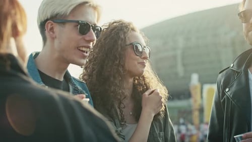 Young Adults Enjoying Music Festival With Friends