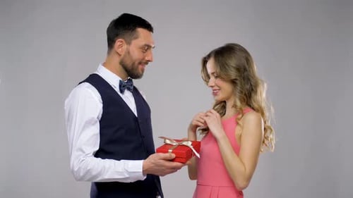 Attractive Couple Celebrating Gift Giving