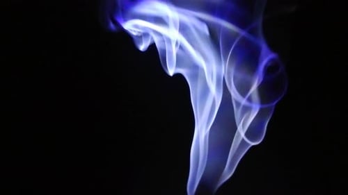 Abstract Blue Smoke Rising Against Black Background
