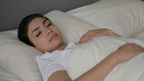 Peaceful Indian Woman Sleeping in Bed