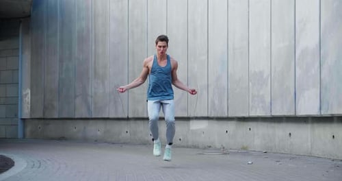 Man Skipping Rope for Fitness in Urban Setting