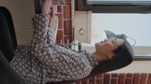 Young Adult Working on Laptop in Urban Home