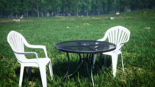 Round Table And Chairs On The Grass Field Garden 4K 02