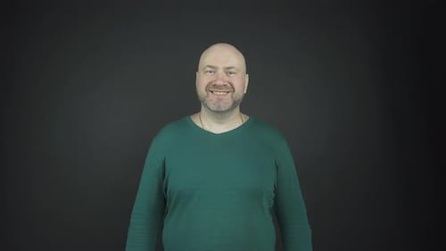 Man in Green Shirt Smiling