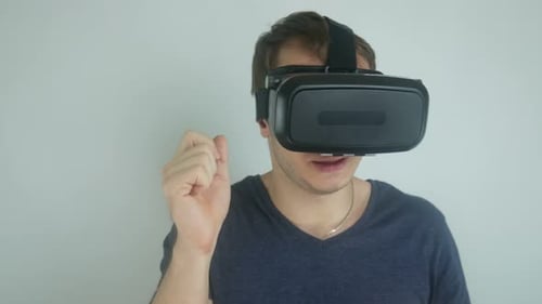 Man Using Virtual Reality Headset Indoors