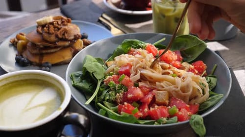 Delicious Salad and Pancakes Meal at Restaurant