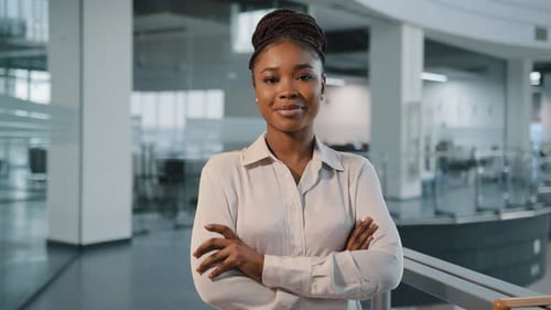 Confident Woman Standing in a Modern Office Space