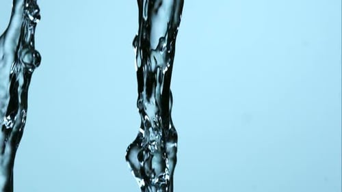 Abstract Close Up of Flowing Water on Blue