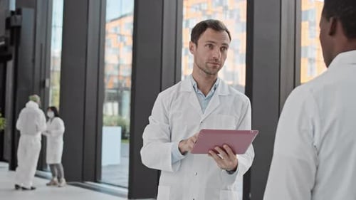 Portrait of Male Caucasian Scientist in Modern Hospital