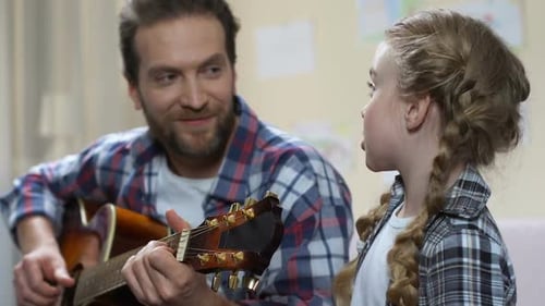Daughter Singing Father Playing Guitar, School Performance Rehearsal, Having Fun