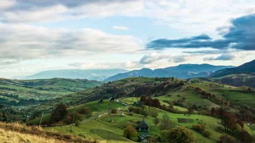 Time Lapse of Blue Sky with Clouds Over Mountain