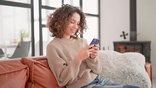 Happy Female Use Mobile in Flat