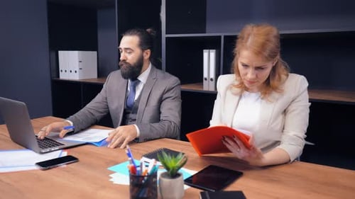 Colleagues Working Together in Modern Office