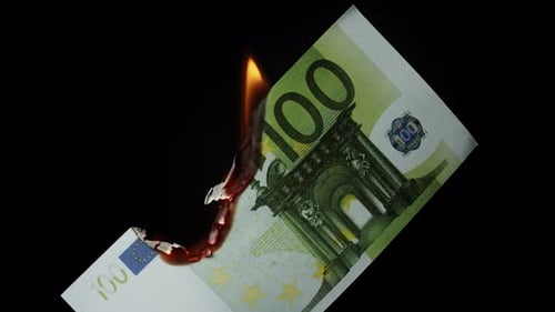 Burning Euro Bill on Black Background