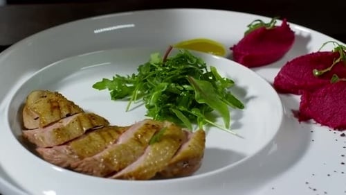 Plating Meat with Salad and Yellow Sauce