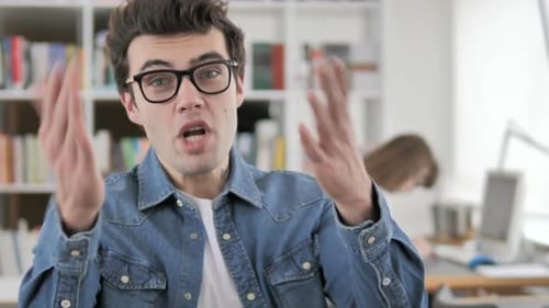 Young Man Reacting to Project Failure