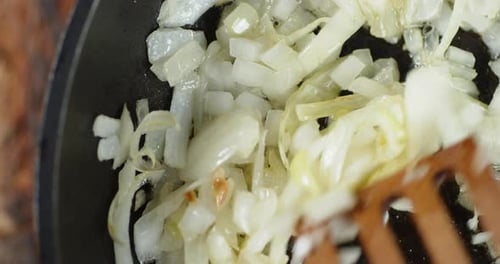 Sauteing Diced White Onions in a Pan