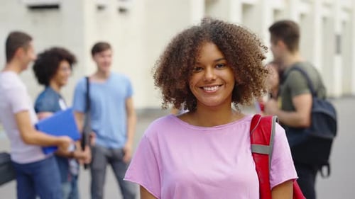 Black Girl Student Smiling at Camera Near College Building