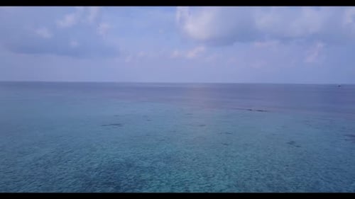 Aerial drone shot panorama of exotic seashore beach holiday by blue water and white sand background