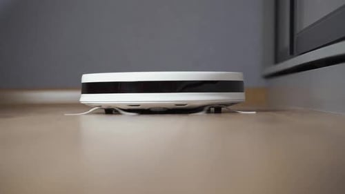 Detailed View on a Selfmoving Robotic Vacuum on the Floor