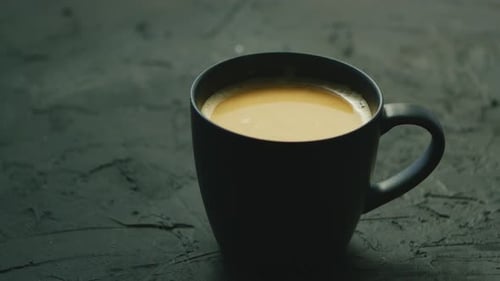 Close Up of Coffee in Black Mug
