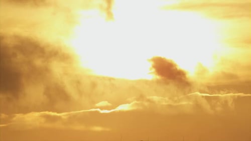 A of the Sun Rising and Setting on the Clouds