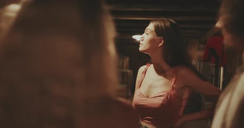 Young Adults Socializing in Dimly Lit Cellar