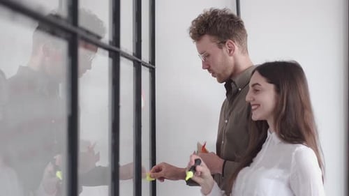 Team Brainstorming Together in Modern Office