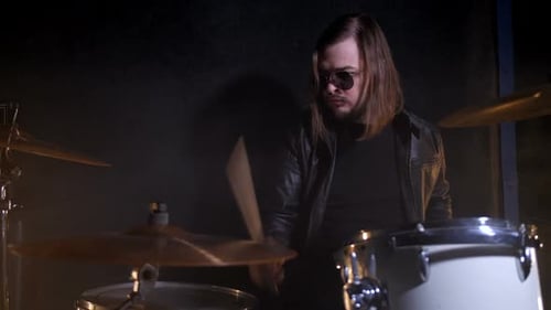 Rock Drum Playing on Drum Set in Record Studio