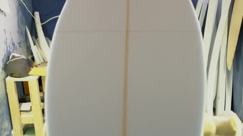 Man making surfboard