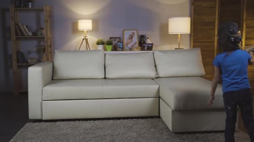 Child Pretends to Fly Wooden Airplane in Living Room