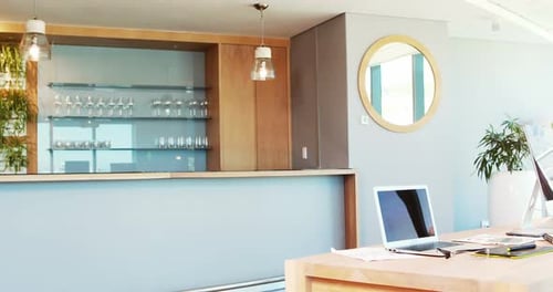 Playful man pushing his colleague on office chair