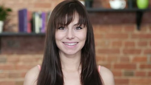 Attractive Young Woman Smiling at Camera