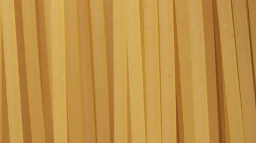 Close Up Of Uncooked Yellow Pasta Noodles