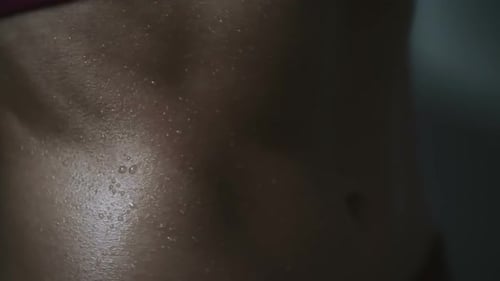 Sweaty Abdomen Glistening After Intense Workout Session