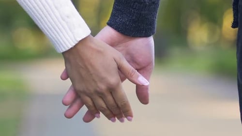 Young Couple Holding Hands and Walking Together, Concept of Support and Trust