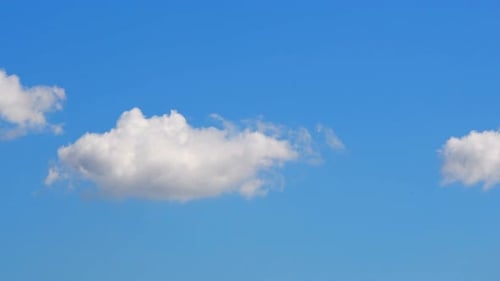 The white cloud changes its shape
