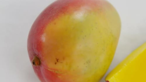 Slices of mango on white background
