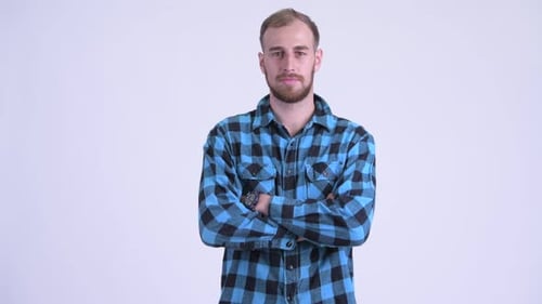 Happy Bearded Hipster Man Smiling with Arms Crossed