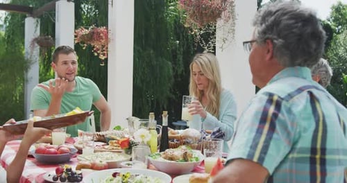 Family Meal Outdoors at Suburban Home