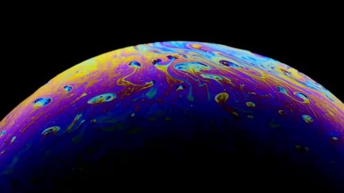 Multicolored Rainbow Colors of a Single Soap Bubble That Looks Like a Fantasy Planet Isolated