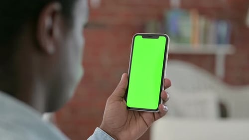 African Man Using Chroma Key Smartphone Screen