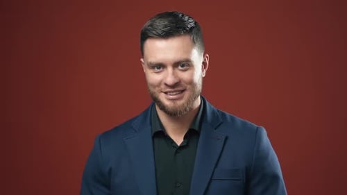 Man Smiling in Blue Blazer