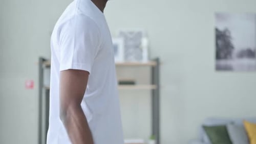 Close Up of Athletic African Man Working Out with Dumbbells