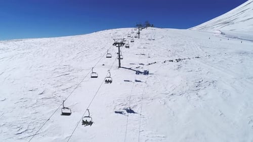 Lift At Ski Resort Transports Skiers