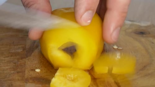 Close - Up Shot of Male Hands Cutting Pepper. Making Salad.