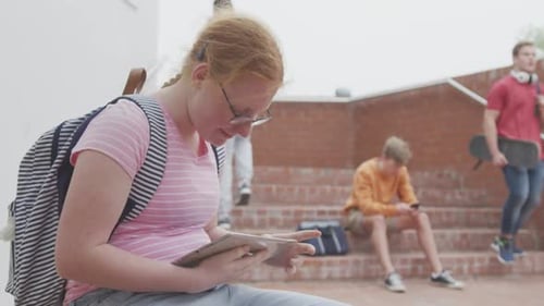 Students on their phones in high school