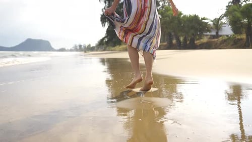 4K Portrait of Beautiful Caucasian woman walking on tropical beach in summer sunny day